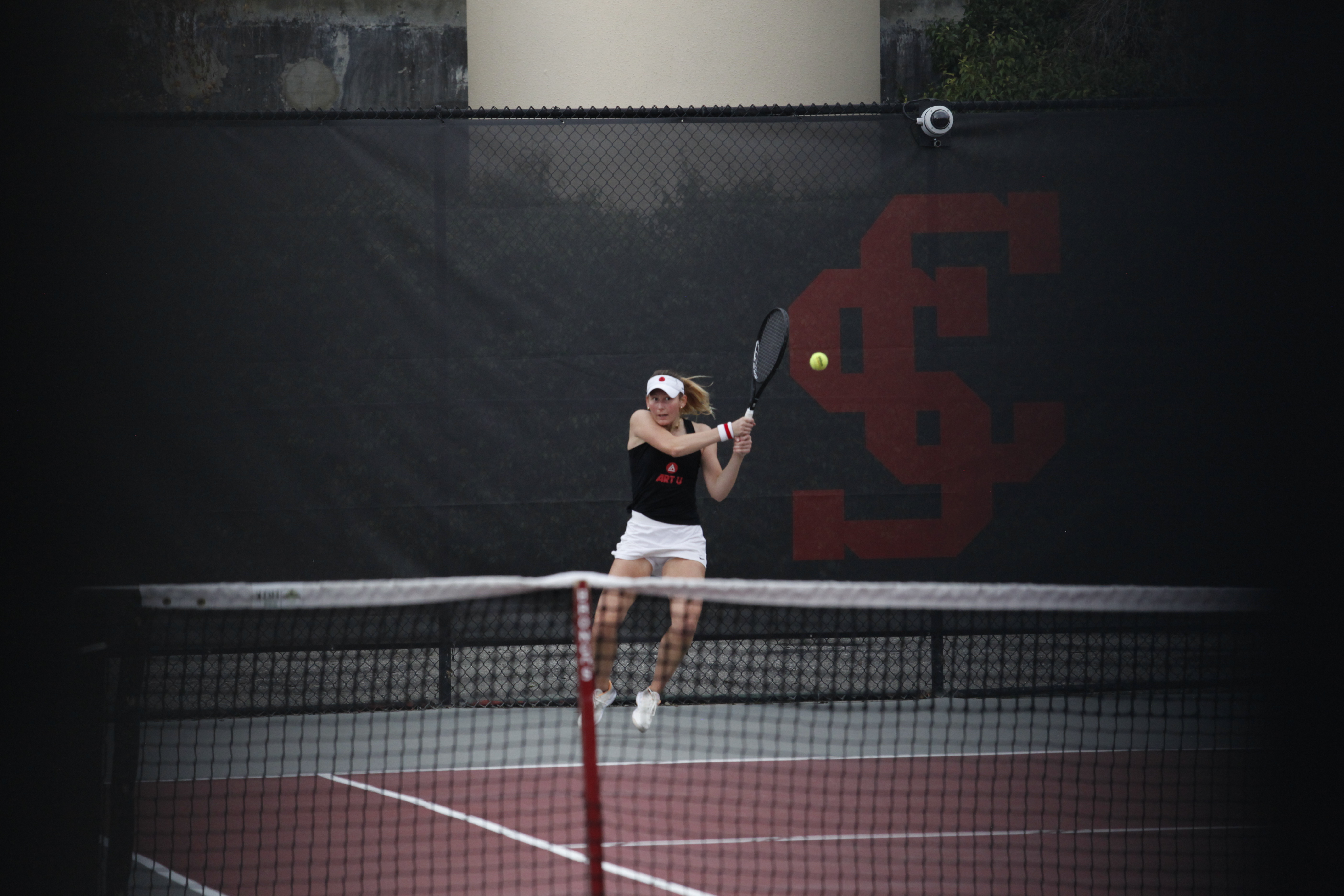 Erica playing collegiate tennis for Academy of Art University